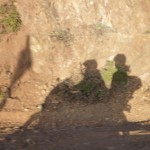 Photo of shadow of riders on motorcycle.