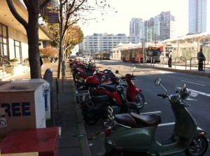 There's a lot of bikes on the streets for "winter." Motorbikes parked in San Francisco in December